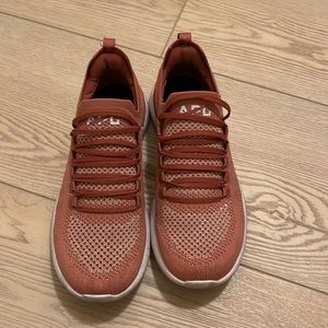 Pink APL tennis shoes